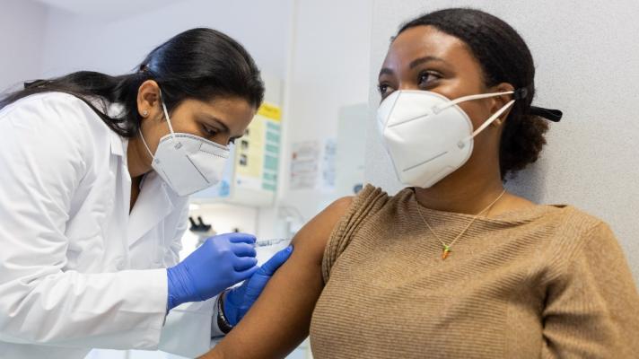 A person receiving the COVID-19 vaccine