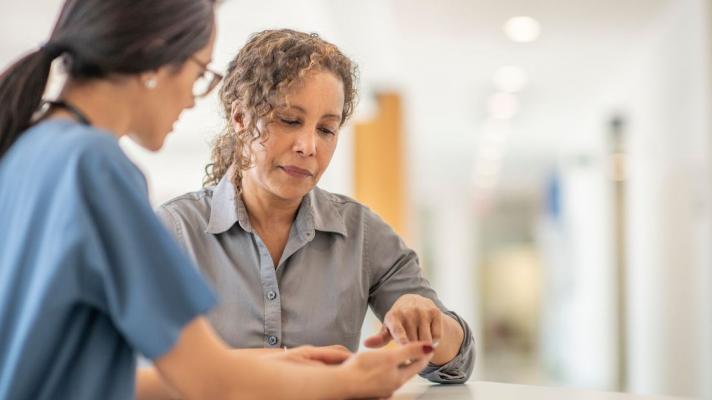 Doctor showing patient phone