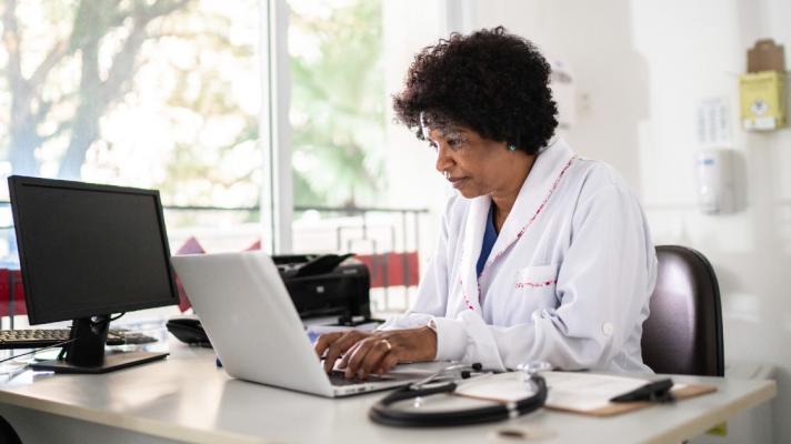 A doctor at a computer