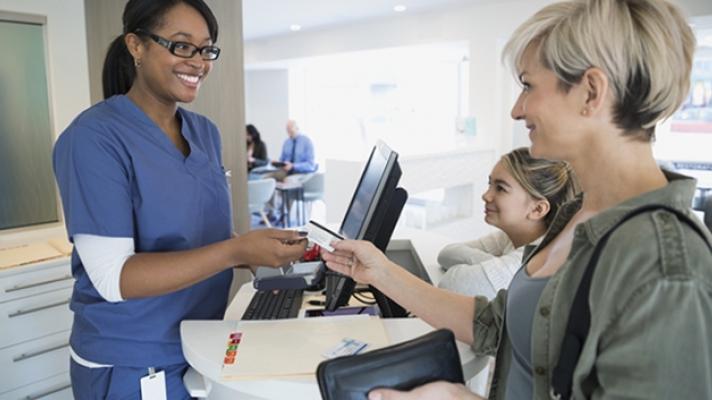 Patient paying at doctors office