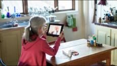 Person having telehealth visit via tablet