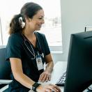 A doctor using a desktop computer