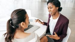 Businesswomen talking.